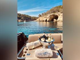 A luxurious setup featuring a selection of chilled wines and cocktails on a yacht, perfect for enjoying a relaxing day on the water.