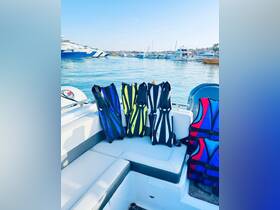 A collection of colorful snorkeling fins and life jackets neatly arranged on a boat, ready for water adventures. Perfect for ensuring safety and fun during aquatic activities.