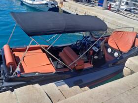 Interior view of a sleek boat featuring comfortable seating and a well-equipped helm, perfect for leisurely outings on the water.