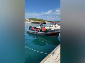 A sleek speedboat docked in calm waters, showcasing its vibrant design and perfect for thrilling adventures on the sea.