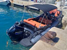 A sleek speedboat docked at the marina, showcasing its stylish design and powerful Mercury engine, perfect for thrilling water adventures.