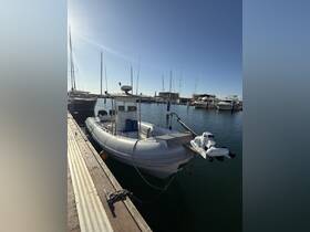 A sleek speedboat docked at the marina, surrounded by other vessels under a clear blue sky — perfect for day trips and water adventures.