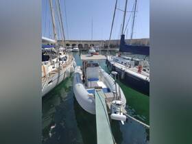 A speedboat docked at the marina, surrounded by various sailboats, showcasing a serene boating environment.