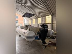 Inside view of a well-maintained boat featuring a helm and spacious seating area, perfect for comfortable outings on the water.