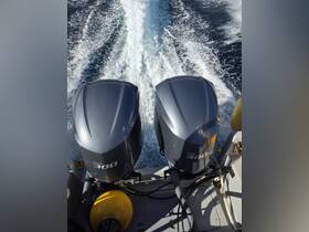 Close-up view of twin Yamaha 300 outboard engines, showcasing essential boat equipment for high-performance cruising.