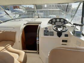 The interior of a boat showcasing the helm and seating area, perfect for navigating the waters in comfort and style.
