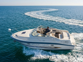 A sleek speedboat glides through the clear waters, showcasing its elegant design and performance — perfect for thrilling water adventures.
