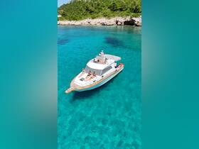 A group of friends relaxes on a boat under the sun, surrounded by stunning turquoise waters — an ideal setting for summer fun and relaxation.
