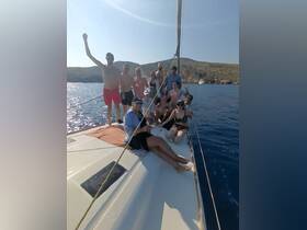 A lively group enjoys a day of sailing, celebrating under the sun with smiles and laughter — perfect for unforgettable summer adventures on the water.