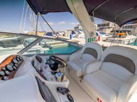 A well-equipped helm area of a boat featuring comfortable seating and essential controls, perfect for navigating the waters in style.