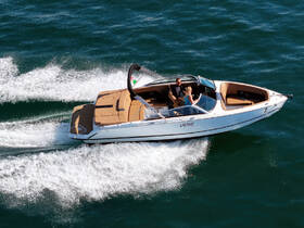 A couple enjoys a thrilling ride on a speedboat, cutting through the waves — perfect for adventure seekers looking to explore the open water.