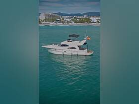 A stunning aerial view of a luxurious yacht docked in clear turquoise waters, perfect for upscale charters and leisure outings.