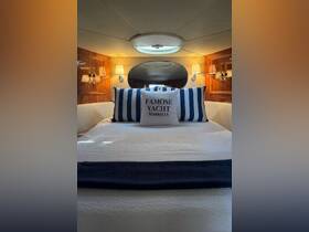 Cozy cabin interior of a yacht featuring elegant decor and a comfortable bed, perfect for relaxing during a luxurious boating experience.