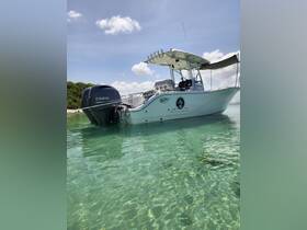 A sleek speedboat anchored in crystal-clear waters, showcasing its modern design and perfect for day trips or water adventures.