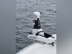 Close-up of a Garmin device mounted on a boat, showcasing essential navigation equipment for a smooth sailing experience.