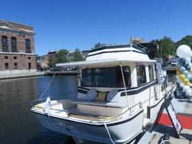 A beautifully docked yacht with a stylish exterior, showcasing a relaxing atmosphere perfect for leisurely outings on the water.