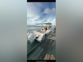 A sleek speedboat docked at the pier, showcasing its modern design and spacious seating — perfect for a day of adventure on the water.