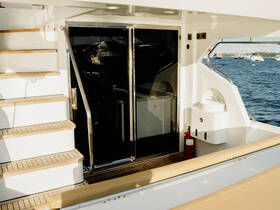 An inviting view of the interior of a yacht, showcasing the elegant staircase and helm area, perfect for a luxurious boating experience.