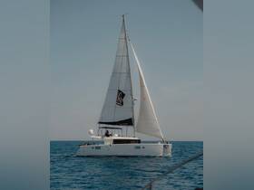 A sleek sailboat navigates the open waters, showcasing its elegant design and sails in action — perfect for sailing enthusiasts and adventure seekers.