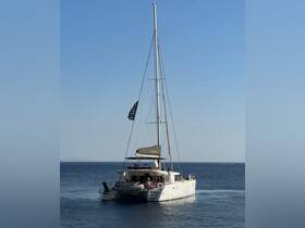 A lively catamaran sails through calm waters with guests enjoying the sun and sea, perfect for a day of adventure on the water.