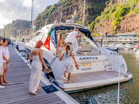 A group of friends boards the luxurious yacht 'Aestus' in Madeira, capturing the excitement of embarking on a memorable boating adventure.