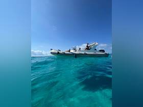 A group enjoys a day on the water aboard a sleek boat, surrounded by crystal-clear turquoise waters — perfect for adventure and relaxation.