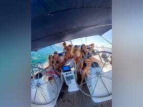 A lively group of friends enjoys a fun sailing experience, capturing joyful moments on the deck of a yacht under the sun.