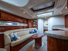 Interior view of a luxurious boat cabin featuring comfortable seating and elegant finishes, perfect for relaxing during your nautical adventures.