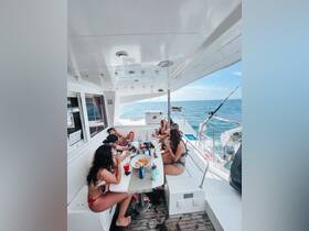 A lively group enjoys drinks and snacks aboard a boat, perfect for a fun day on the water with friends.