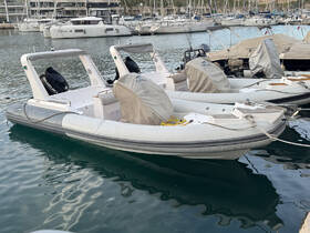 A sleek speedboat docked in a marina, showcasing its modern design and pristine condition — perfect for day trips or water sports.