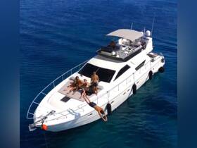 A lively group enjoys a sunny day on a yacht, with one person diving into the clear blue waters while others relax on the deck — perfect for summer adventures and fun on the water.