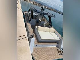 A spacious interior view of a modern boat featuring comfortable seating, perfect for relaxing while cruising or entertaining guests.