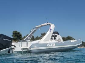 A sleek speedboat captured in clear waters, showcasing its modern design and features, perfect for thrilling adventures on the sea.