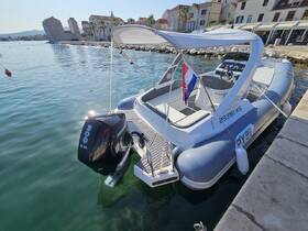 A sleek speedboat docked in calm waters, showcasing its modern design and powerful outboard motor — perfect for thrilling adventures on the water.