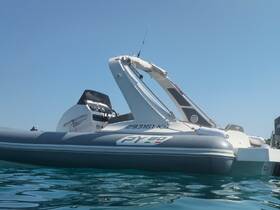 A sleek speedboat captured from the side, showcasing its design against a clear blue sky and tranquil waters, perfect for thrilling adventures on the sea.