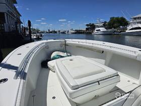 An interior view of a boat showcasing the seating and helm area, perfect for a day out on the water.
