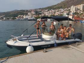 A joyful family poses on their boat, enjoying a sunny day on the water — perfect for summer adventures and family outings.