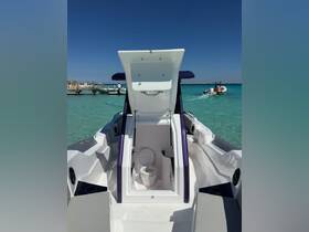 Interior view of a boat's bathroom, showcasing a clean and modern toilet setup, ideal for comfort during outings on the water.