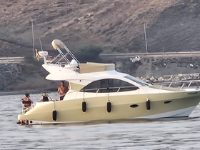 A lively group enjoys their time aboard a yacht, showcasing the fun and relaxation of a day on the water.