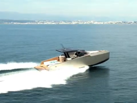 A sleek speedboat glides through the water, showcasing its impressive design and performance — perfect for thrilling adventures on the open sea.