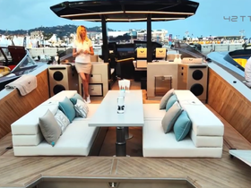 A stylish interior view of a yacht's lounge area featuring comfortable seating and a modern design, perfect for relaxing on the water.
