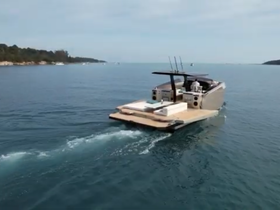 A sleek speedboat navigates through calm waters, showcasing its modern design and cruising capabilities — perfect for adventurous outings on the water.