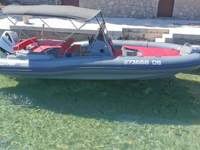 A sleek speedboat named 'Lucy' docked in clear waters, showcasing its modern design and comfortable seating.
