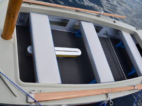 An interior view of a boat featuring spacious seating arrangements, ideal for relaxing while enjoying the water.