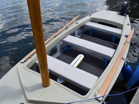 Interior view of a boat showcasing spacious seating arrangements, perfect for a comfortable day on the water.