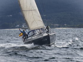 A lively sailing scene captures crew members celebrating aboard a yacht, showcasing the thrill of sailing on open waters.