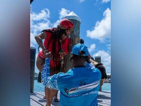 A joyful moment captured at the dock as guests prepare for an adventure, showcasing the excitement of embarking on a boat tour.