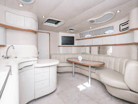 A spacious and elegantly designed interior of a boat cabin featuring comfortable seating and modern amenities, perfect for relaxing during your maritime adventures.