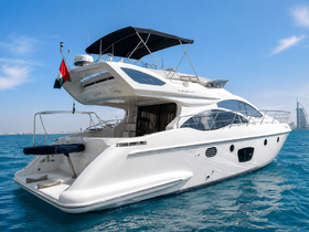 A stunning Azimut yacht captured in clear blue waters, showcasing its elegant design and luxurious features — perfect for upscale boating experiences.