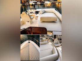 A beautifully designed interior of a boat showcasing the helm and seating area, perfect for comfortable cruising and relaxation on the water.